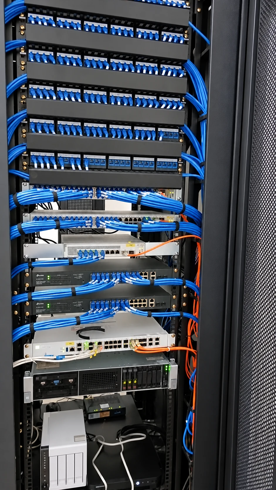 Completed network rack with structured cabling and network equipment